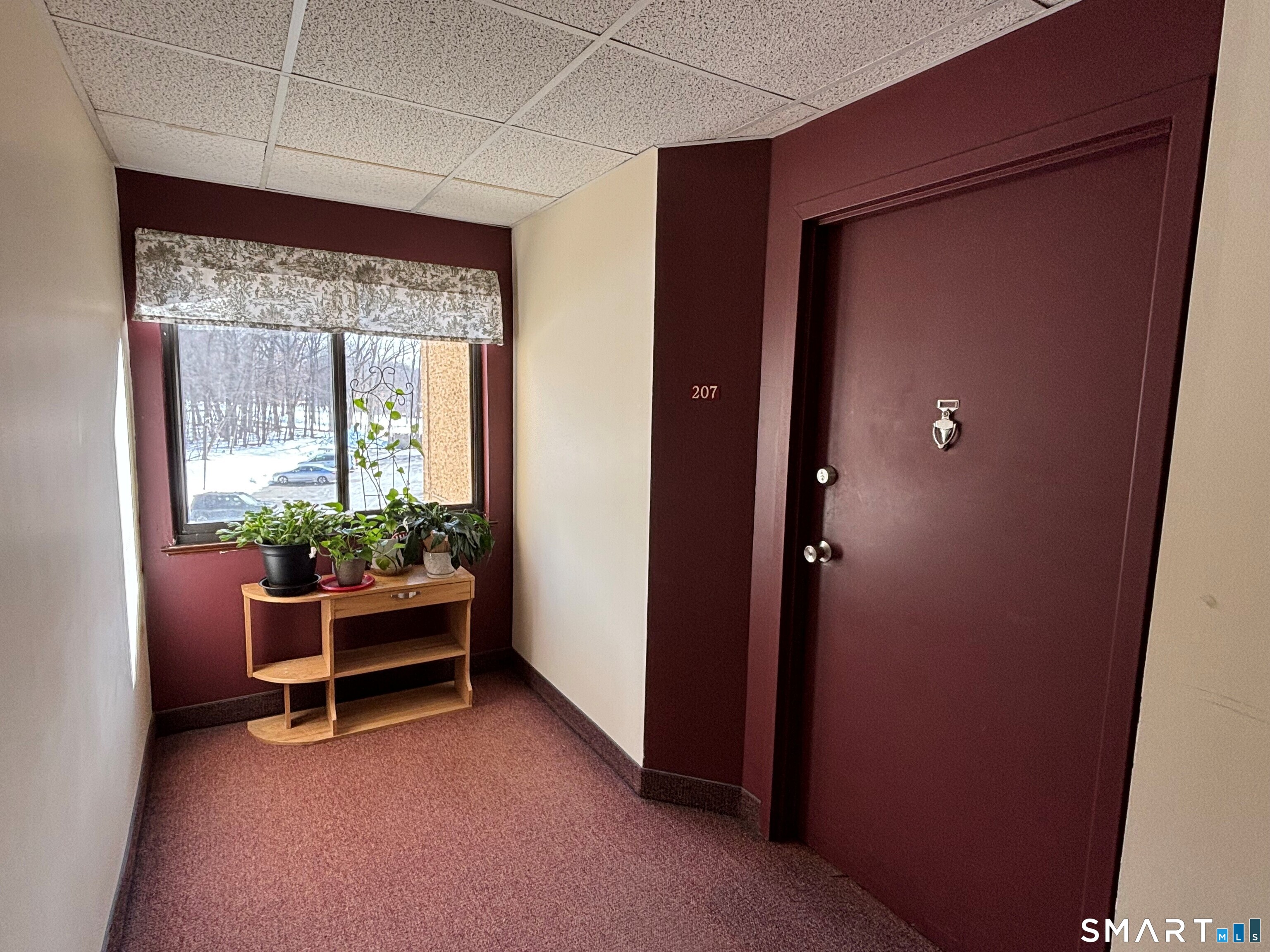 16 Putter Drive, Unit 207S Wallingford, CT 06492 - Photo 1 of 15 a view of room with window and furniture