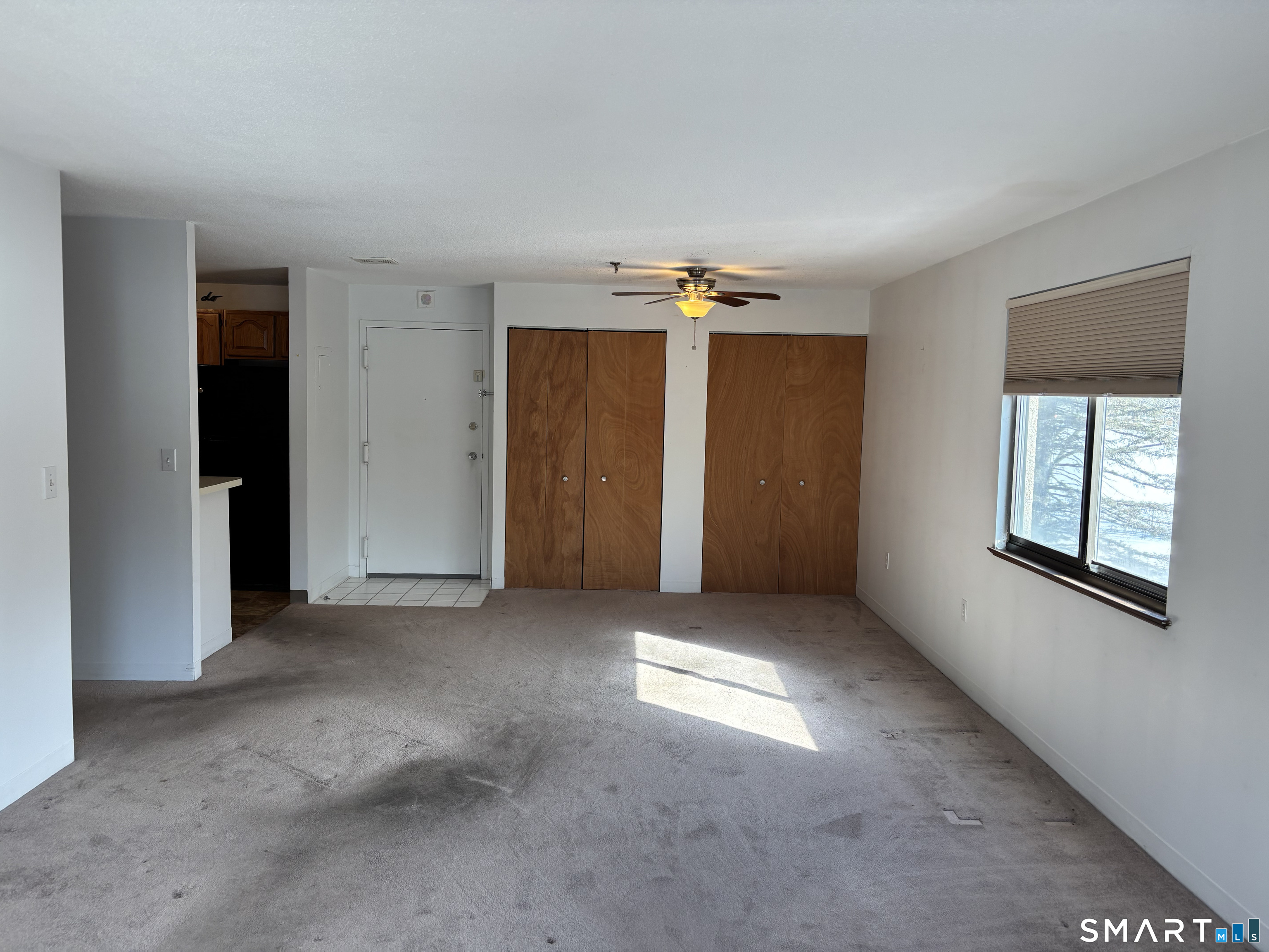 16 Putter Drive, Unit 207S Wallingford, CT 06492 - Photo 4 of 15 an empty room with windows and closet