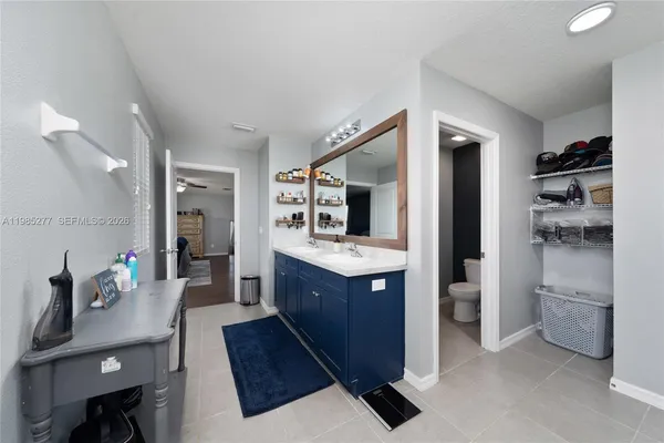 a bed room with a bed and a book shelf