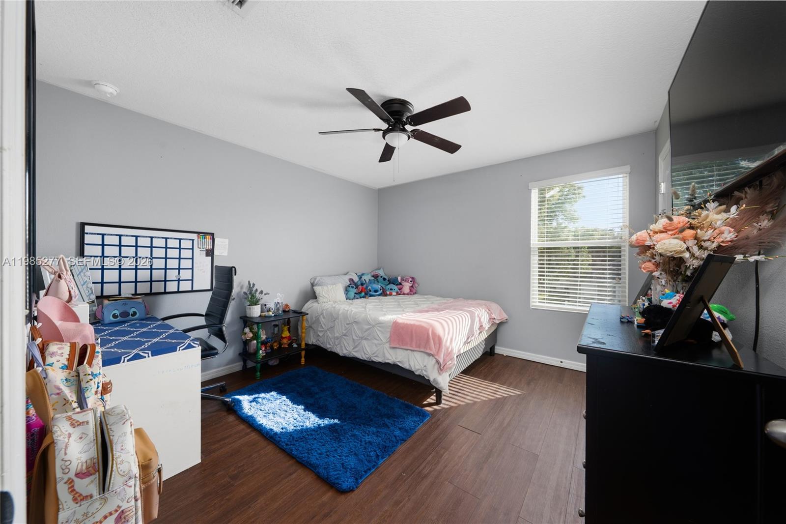 2824 Northeast 43rd Road Ocala, FL 34470 - Photo 24 of 45 a bedroom with a bed dresser and a window