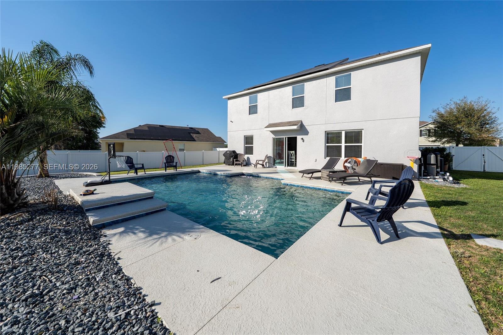 2824 Northeast 43rd Road Ocala, FL 34470 - Photo 29 of 45 a view of a house with backyard and sitting area