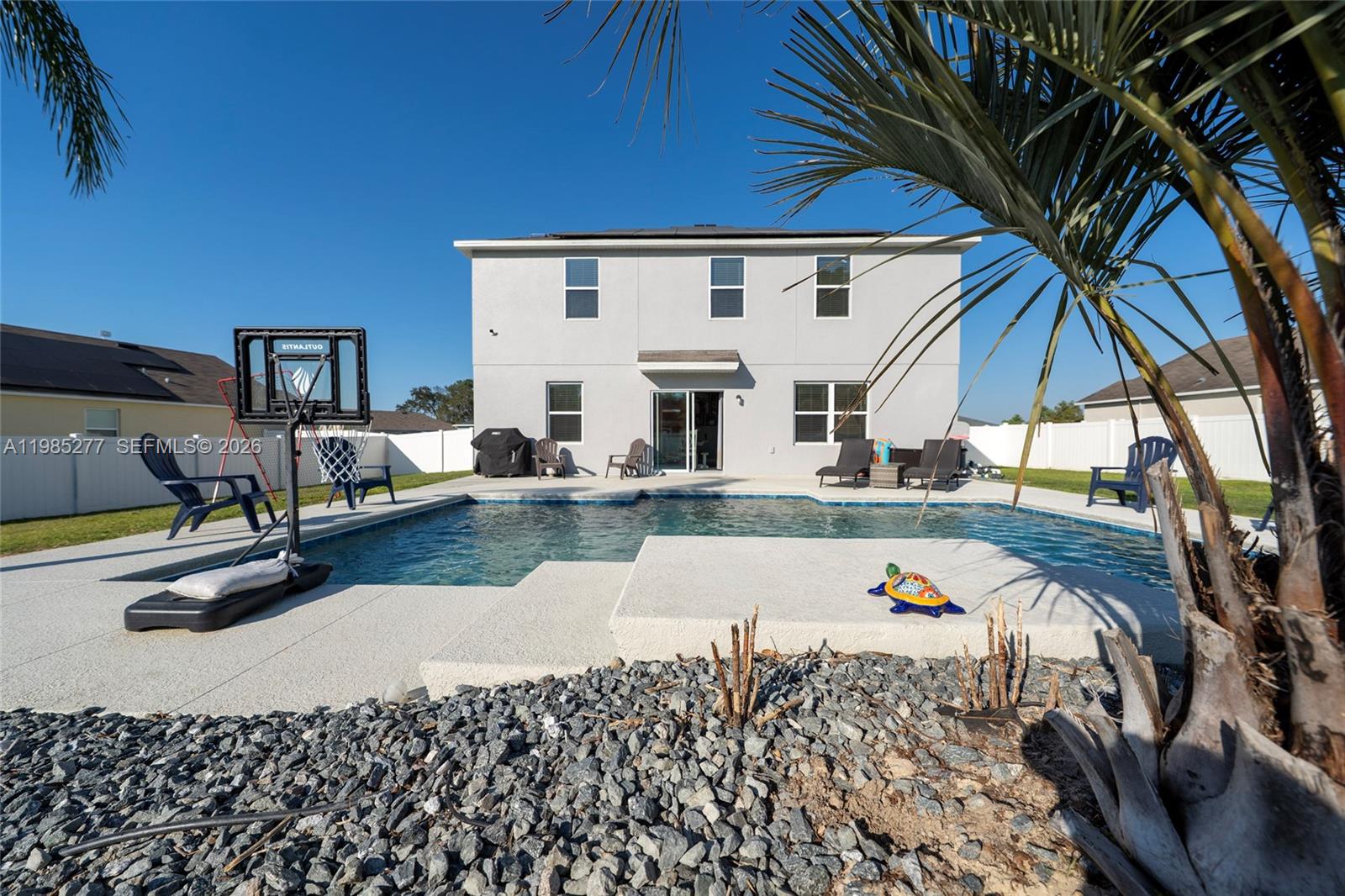 2824 Northeast 43rd Road Ocala, FL 34470 - Photo 31 of 45 a view of a house with swimming pool and sitting area