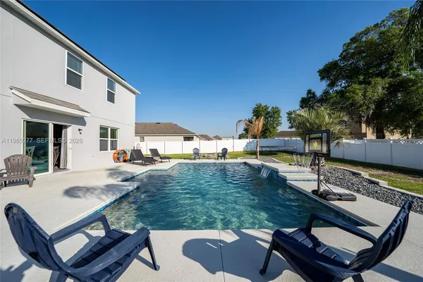 an aerial view of a houses with outdoor space