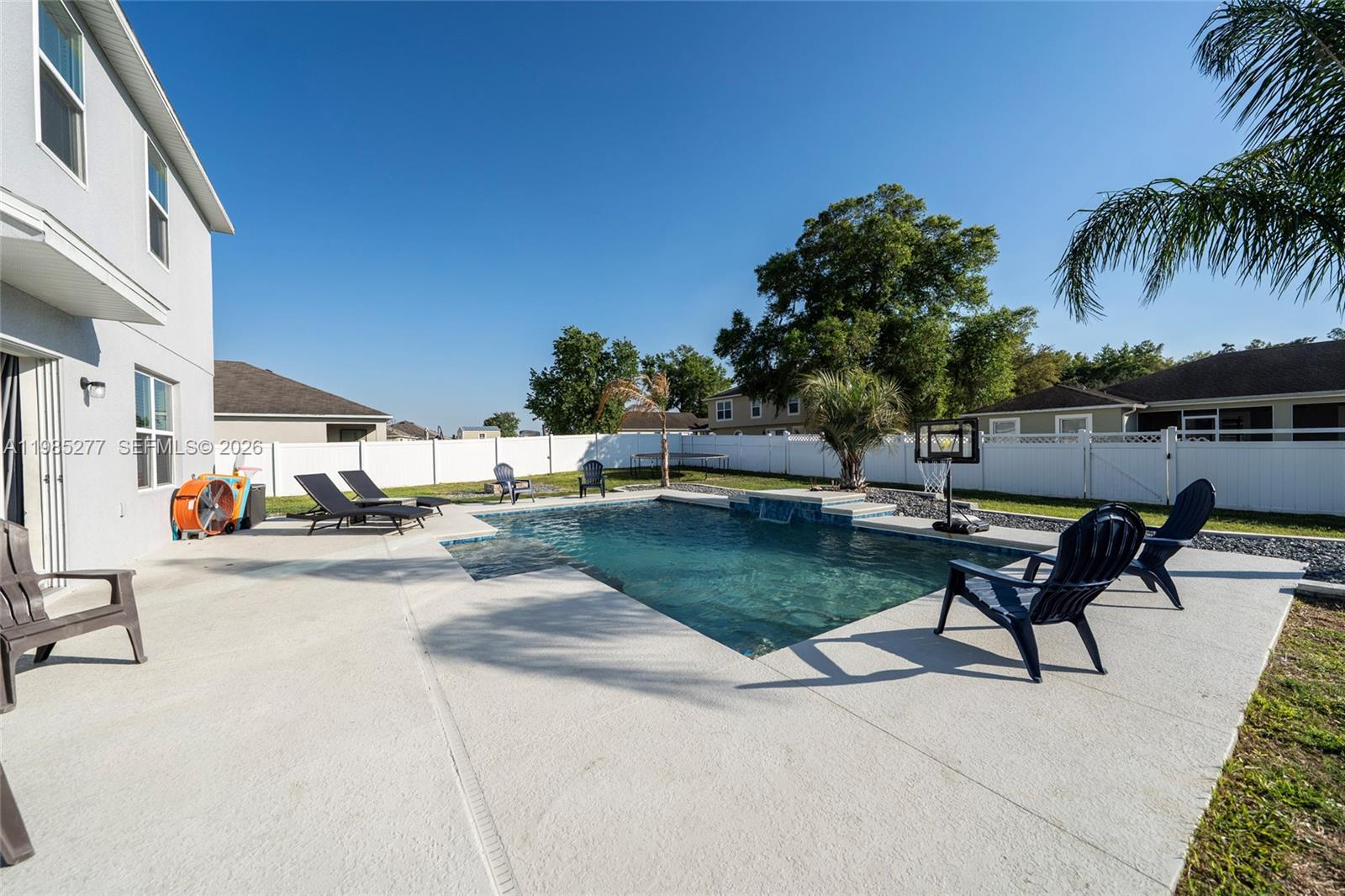 2824 Northeast 43rd Road Ocala, FL 34470 - Photo 34 of 45 a view of a backyard with a patio and swimming pool