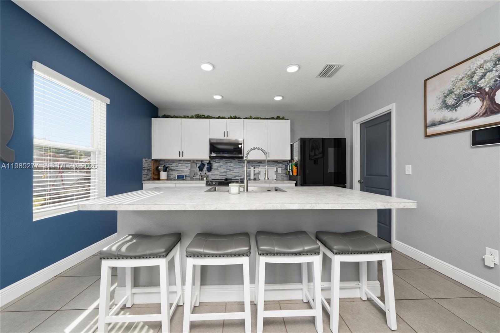 2824 Northeast 43rd Road Ocala, FL 34470 - Photo 9 of 45 a view of a dining room with furniture and window
