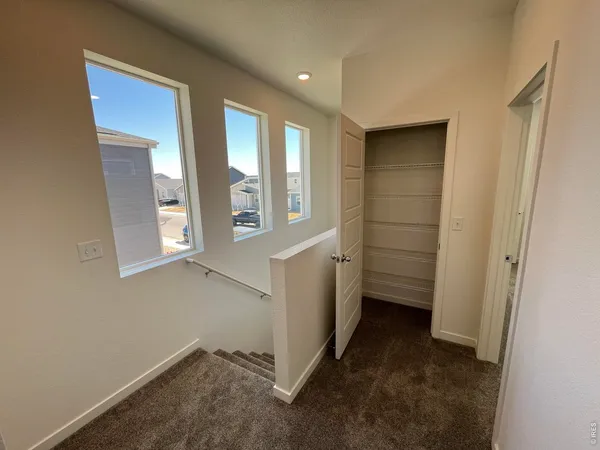 a view of entryway and hall with a window