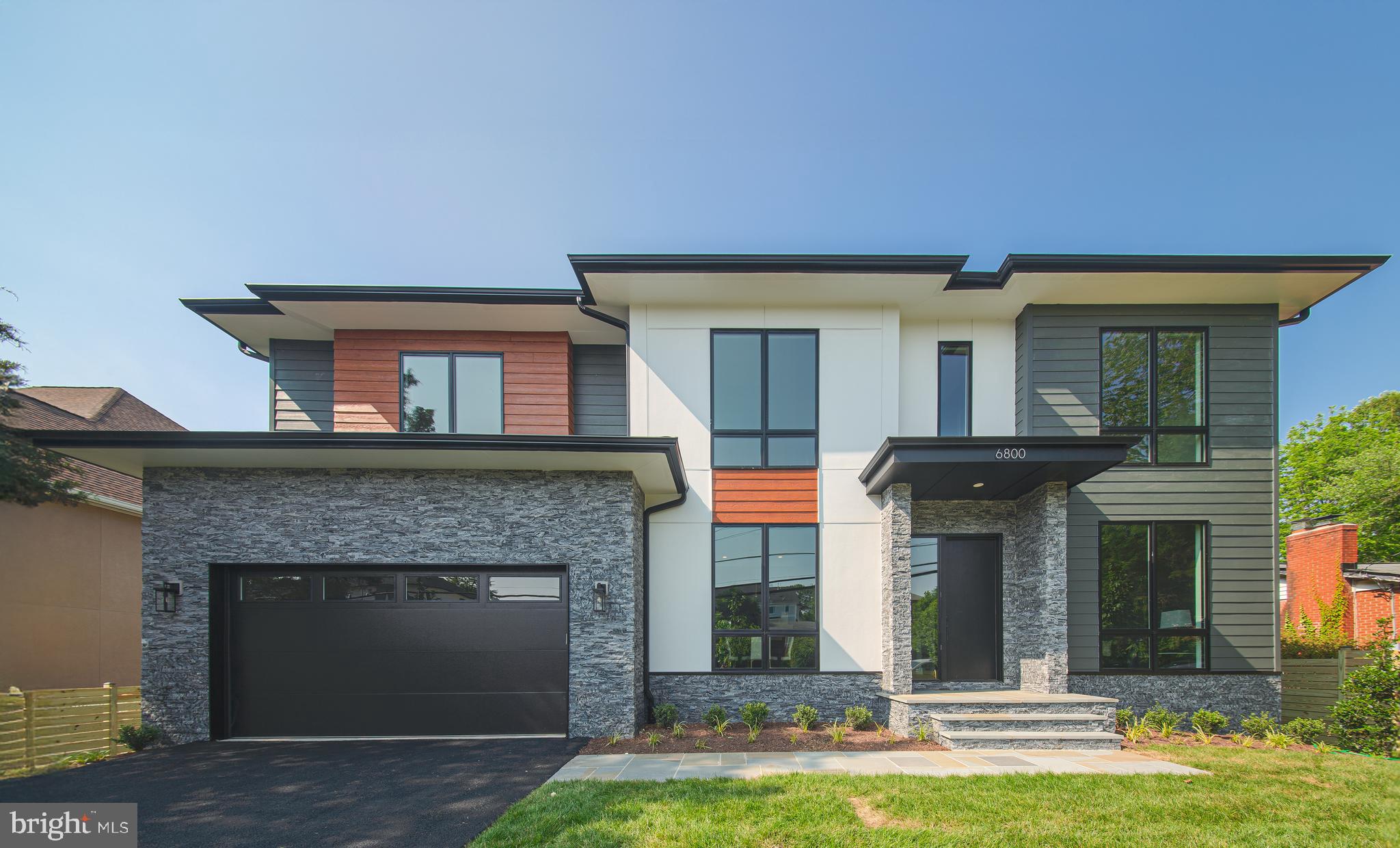 a front view of a house with yard