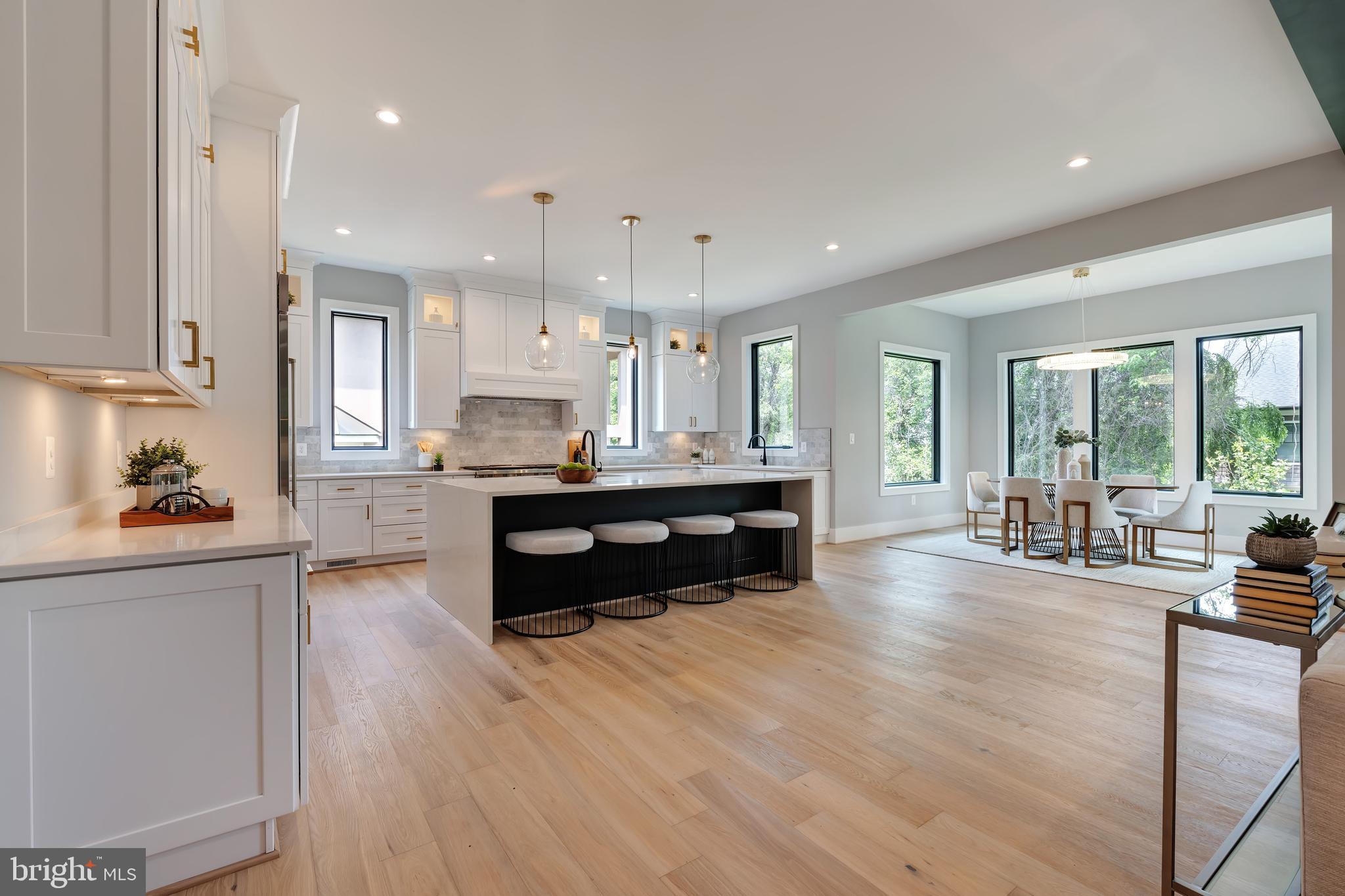 6800 Old Chesterbrook Road McLean, VA 22101 - Photo 13 of 44 a living room with kitchen island furniture and a wooden floor