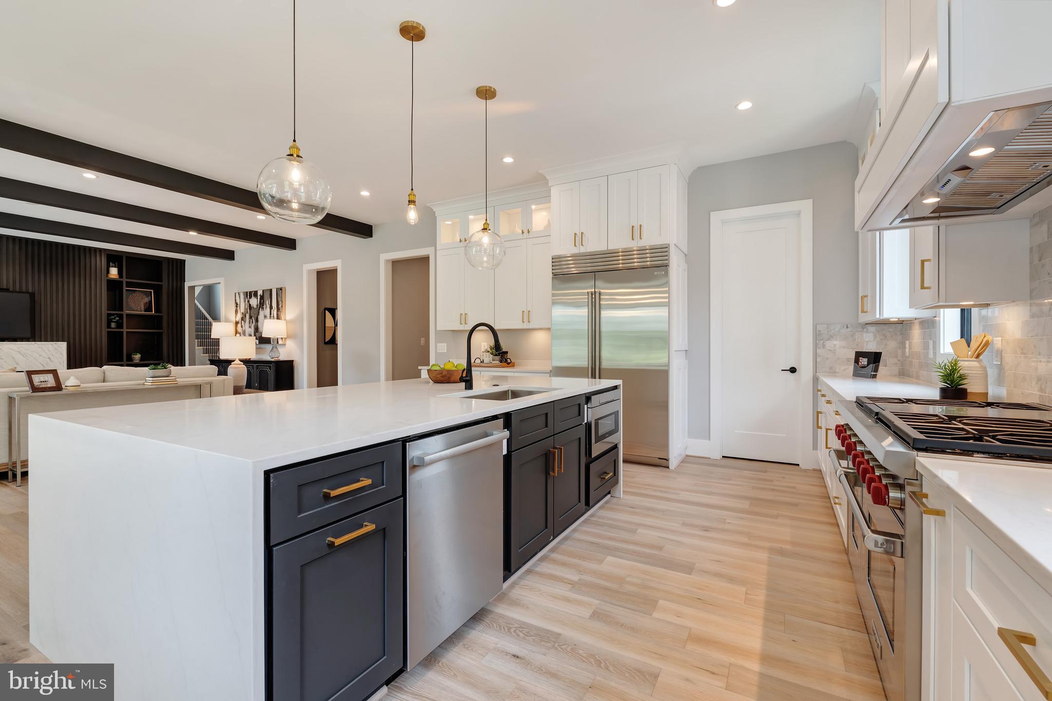 6800 Old Chesterbrook Road McLean, VA 22101 - Photo 16 of 44 a kitchen with stainless steel appliances granite countertop a sink a stove and a refrigerator