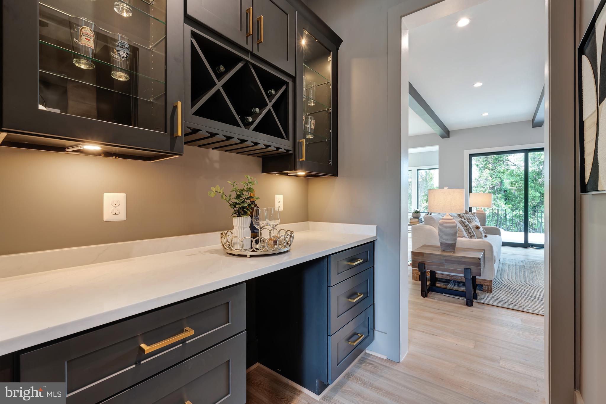 6800 Old Chesterbrook Road McLean, VA 22101 - Photo 19 of 44 a kitchen with stainless steel appliances a sink dishwasher and a microwave oven with wooden floor