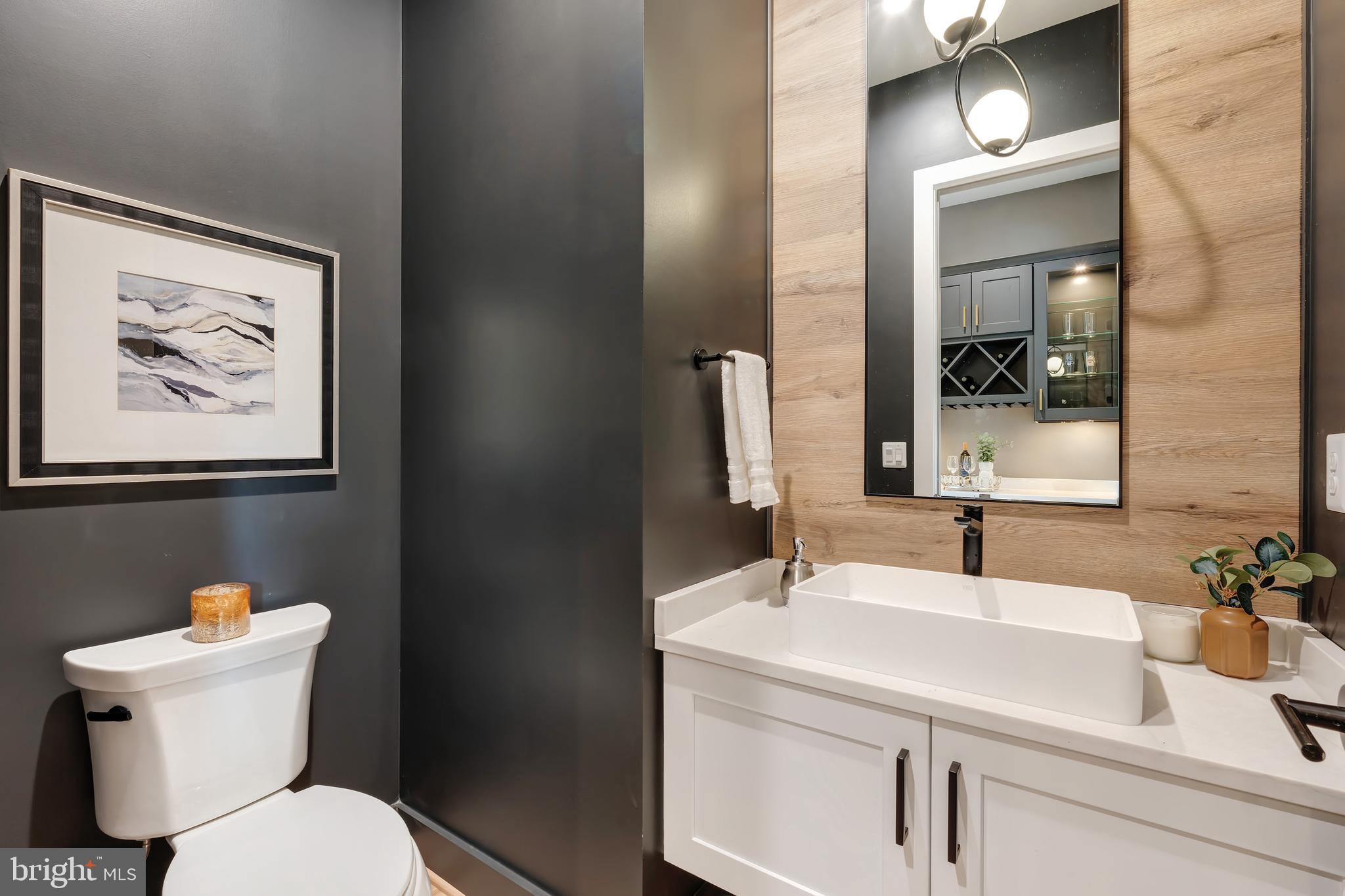 6800 Old Chesterbrook Road McLean, VA 22101 - Photo 20 of 44 a bathroom with a toilet sink and mirror