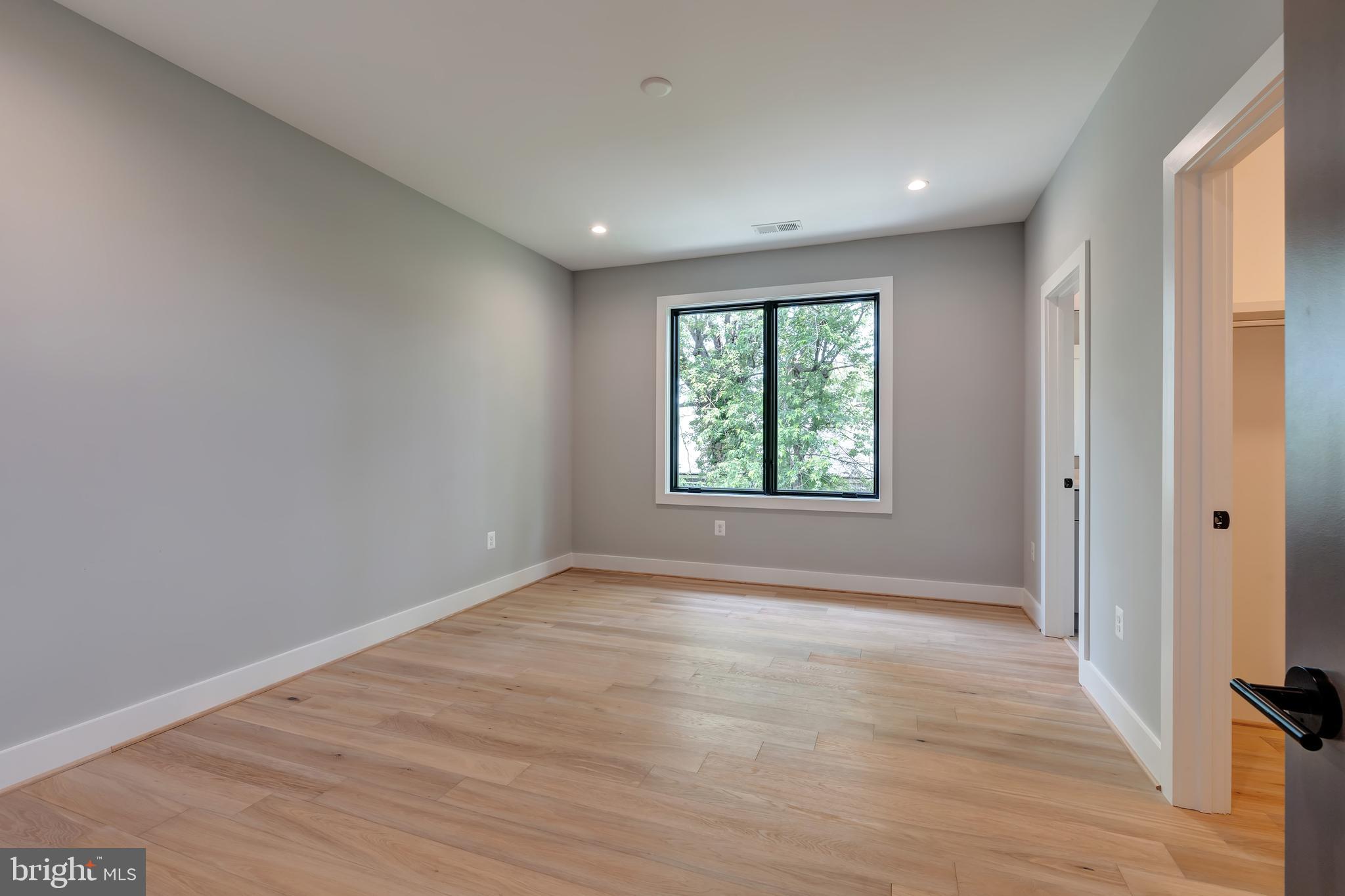 6800 Old Chesterbrook Road McLean, VA 22101 - Photo 21 of 44 wooden floor in an empty room with a window
