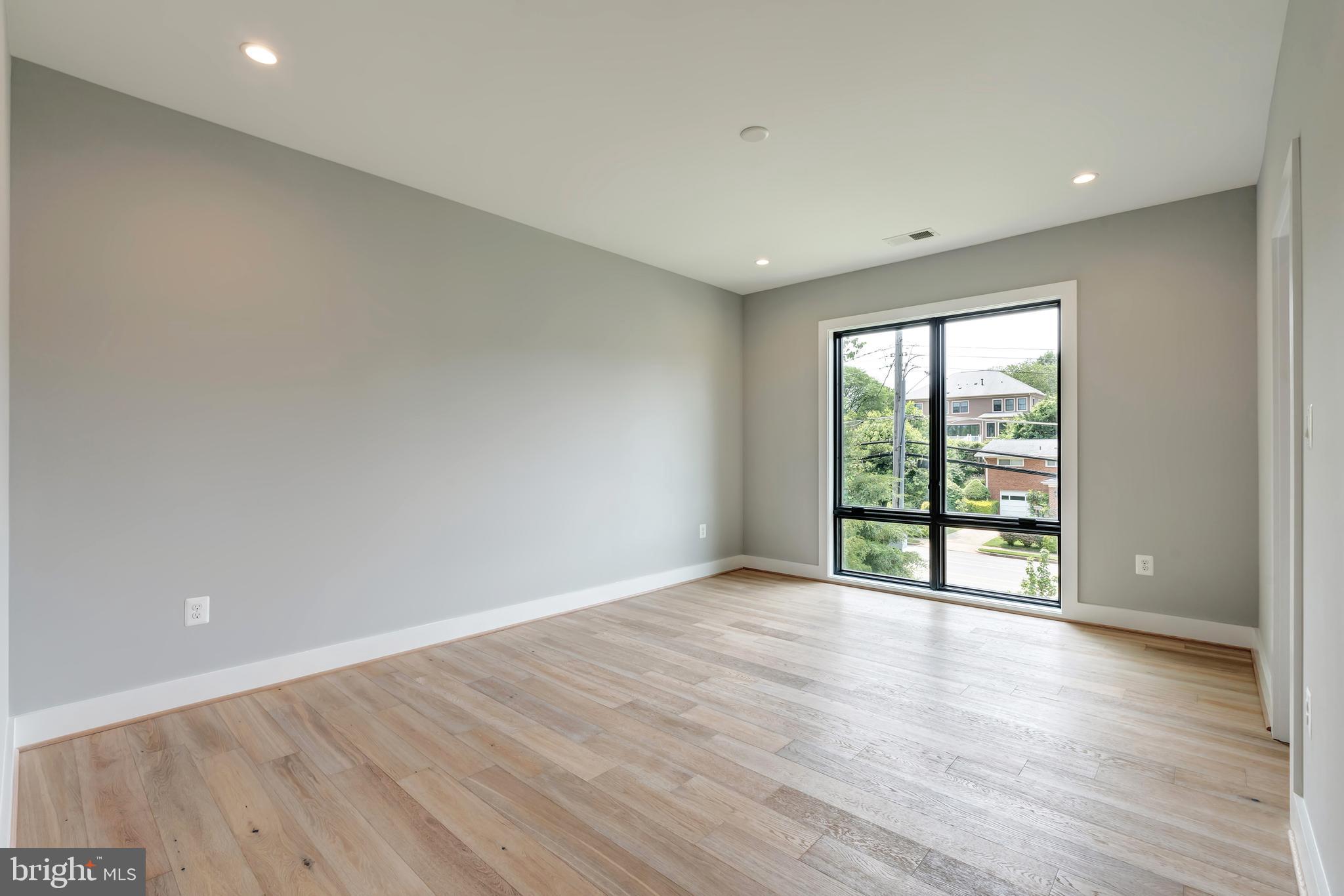 6800 Old Chesterbrook Road McLean, VA 22101 - Photo 24 of 44 a view of an empty room with wooden floor and a window