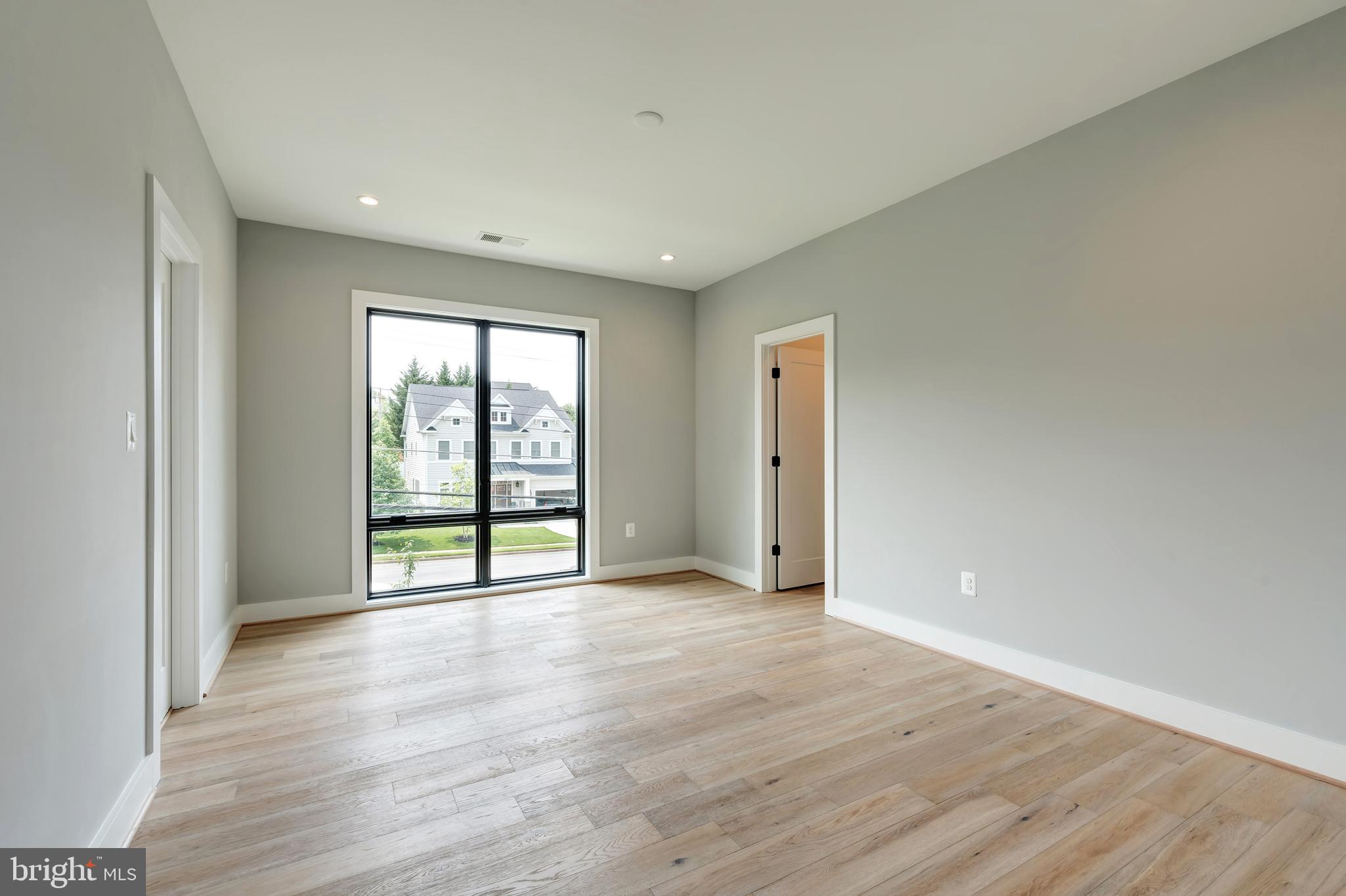 6800 Old Chesterbrook Road McLean, VA 22101 - Photo 26 of 44 a view of an empty room with wooden floor and a window