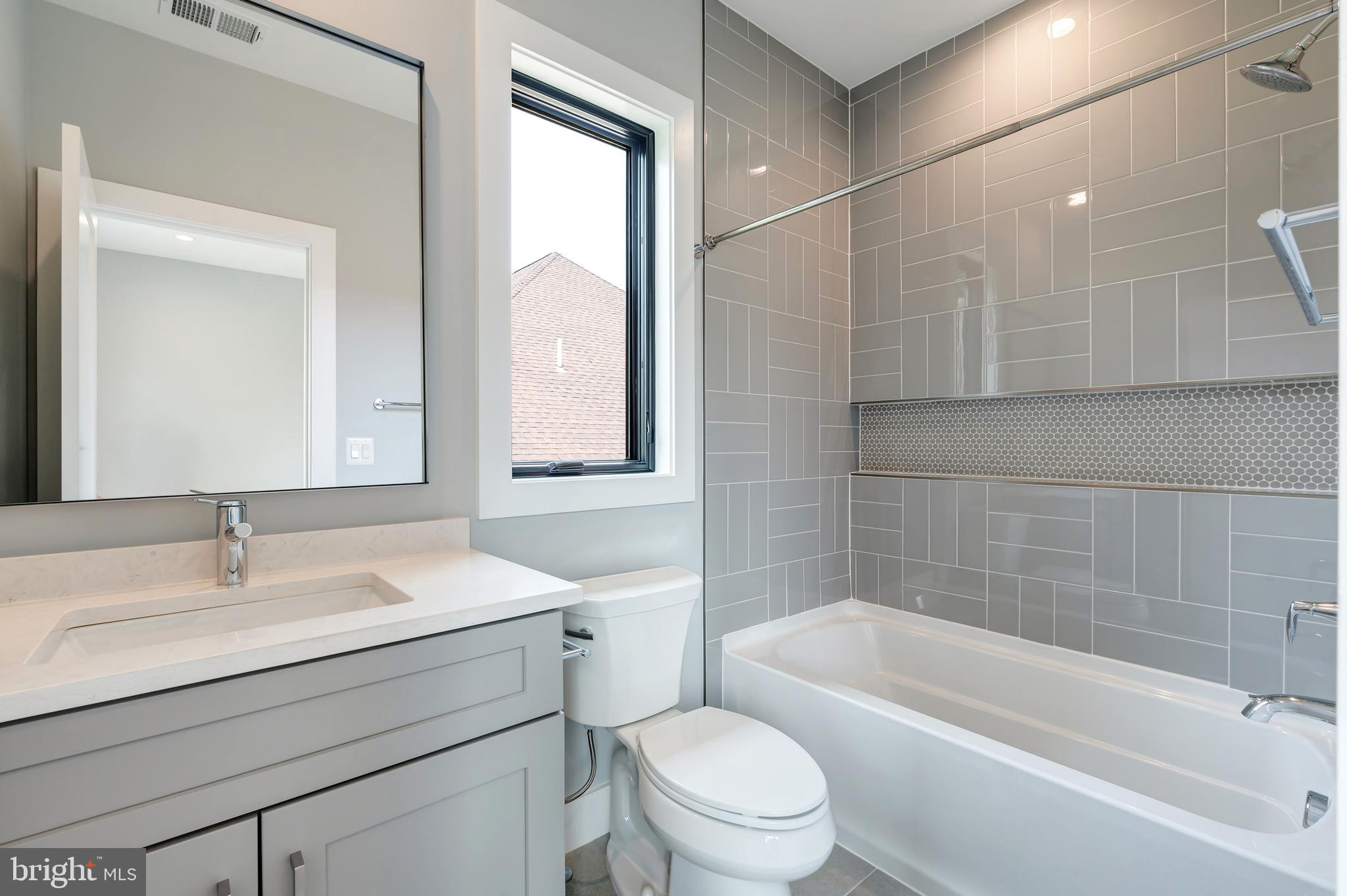 6800 Old Chesterbrook Road McLean, VA 22101 - Photo 27 of 44 a bathroom with a sink mirror toilet and bathtub