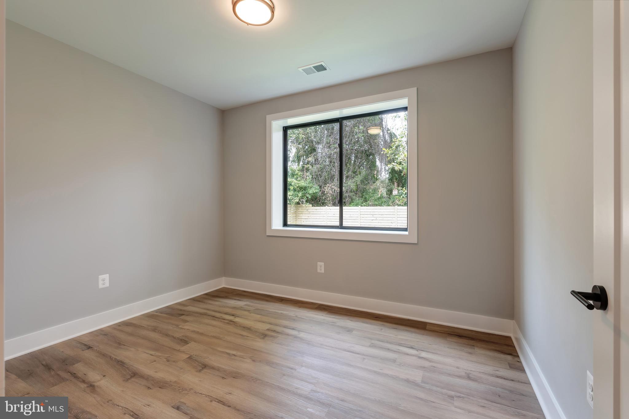 6800 Old Chesterbrook Road McLean, VA 22101 - Photo 37 of 44 wooden floor in an empty room with a window