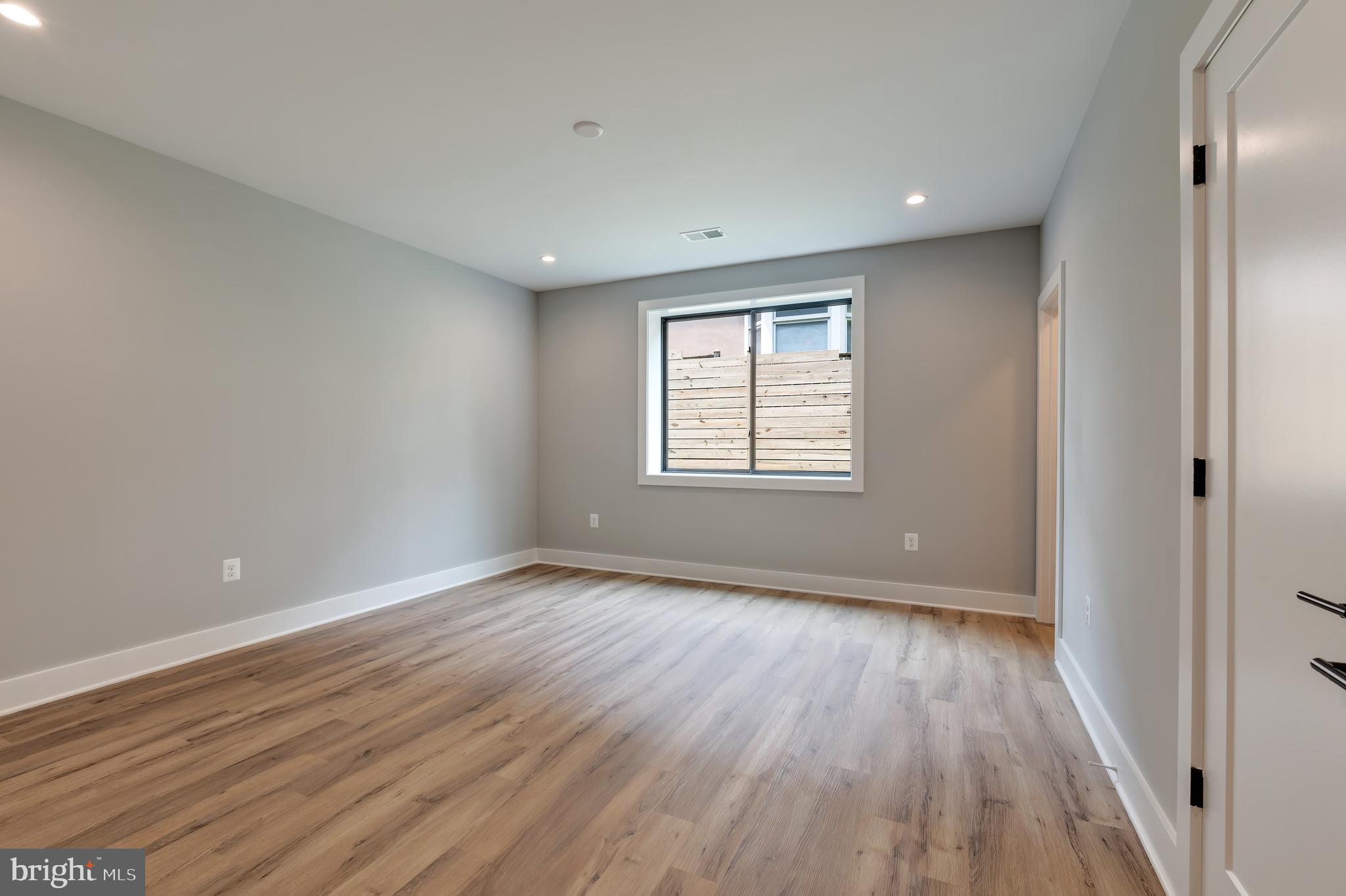 6800 Old Chesterbrook Road McLean, VA 22101 - Photo 38 of 44 a view of an empty room with wooden floor and a window