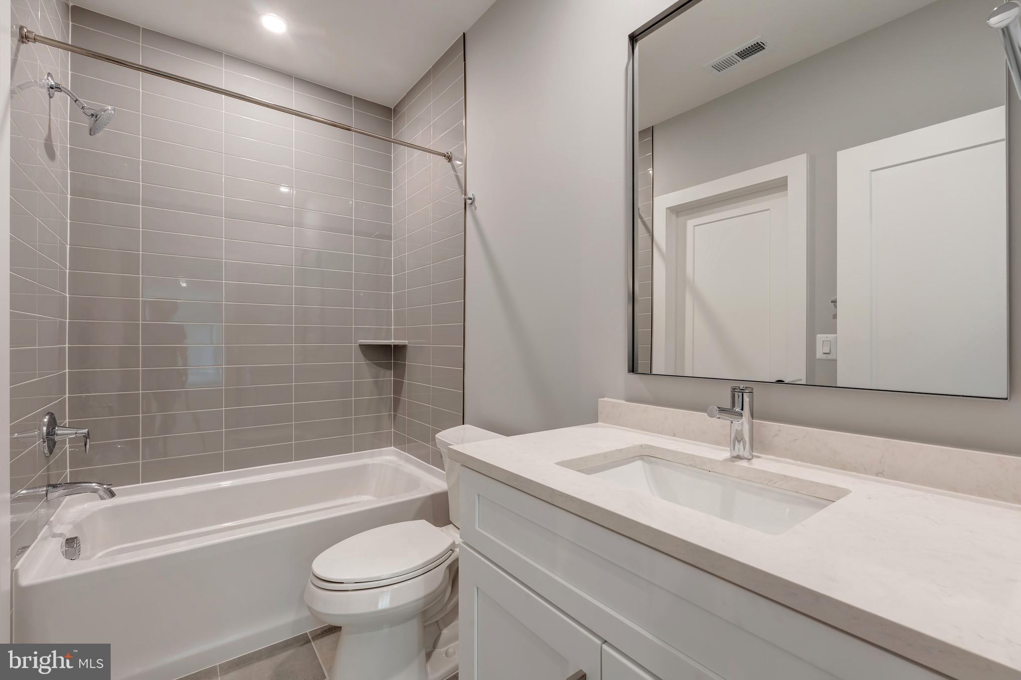 6800 Old Chesterbrook Road McLean, VA 22101 - Photo 39 of 44 a bathroom with a sink a toilet and a bathtub