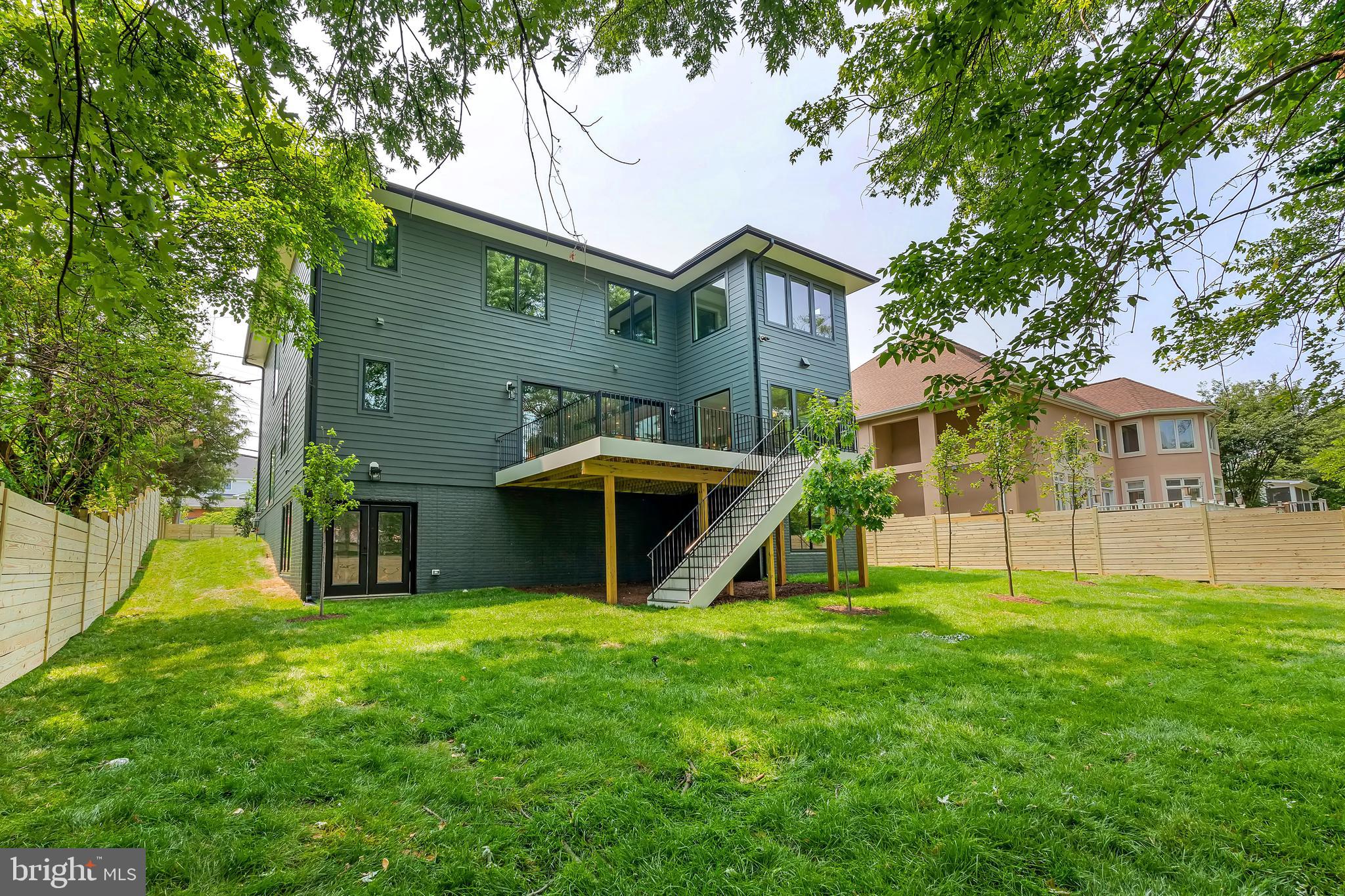 6800 Old Chesterbrook Road McLean, VA 22101 - Photo 43 of 44 a view of a house with a big yard and a large tree