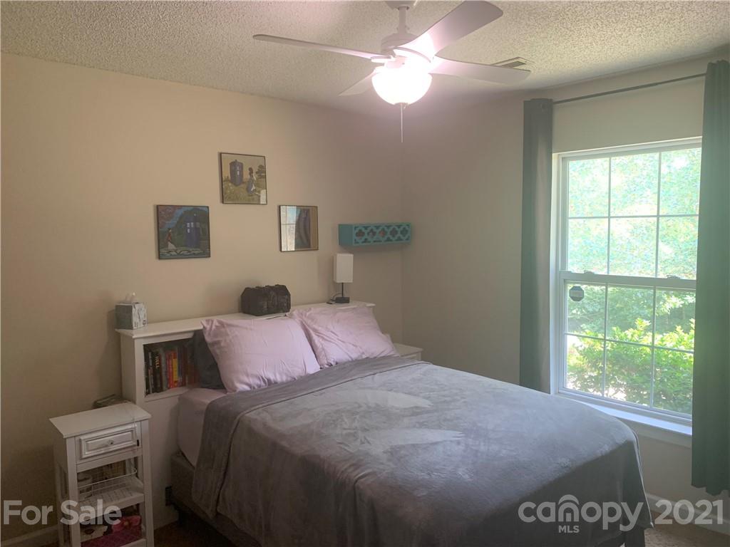 111 Creek View Road Mooresville, NC 28117 - Photo 14 of 25 a bedroom with a bed and a window