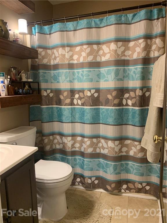111 Creek View Road Mooresville, NC 28117 - Photo 17 of 25 a bathroom with a toilet and a shower