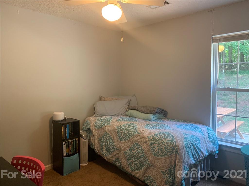 111 Creek View Road Mooresville, NC 28117 - Photo 19 of 25 a bedroom with a bed and window