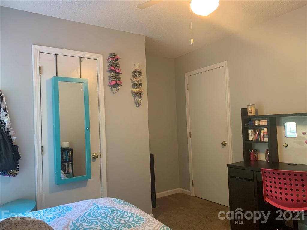 111 Creek View Road Mooresville, NC 28117 - Photo 20 of 25 a bedroom with a bed and bathroom