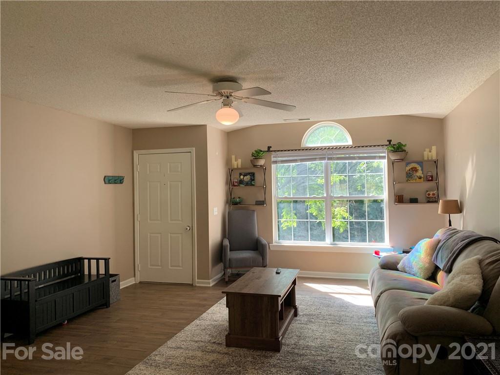 111 Creek View Road Mooresville, NC 28117 - Photo 5 of 25 a living room with furniture and a large window