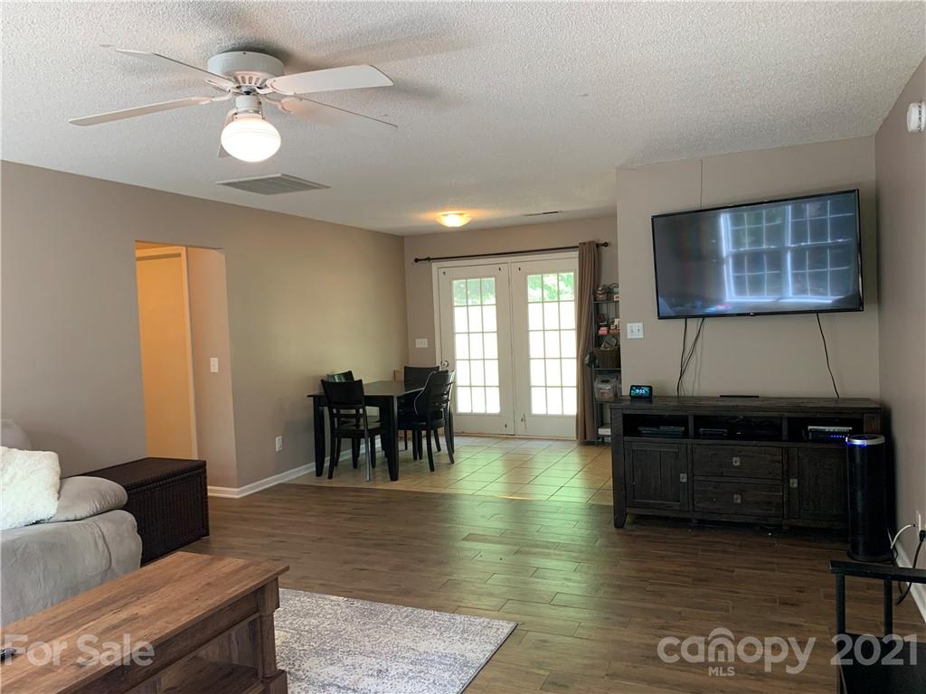 111 Creek View Road Mooresville, NC 28117 - Photo 7 of 25 a living room with furniture and a dining table