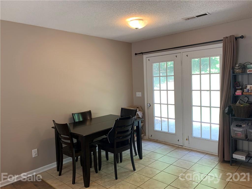 111 Creek View Road Mooresville, NC 28117 - Photo 8 of 25 a view of a dining room with furniture and a window