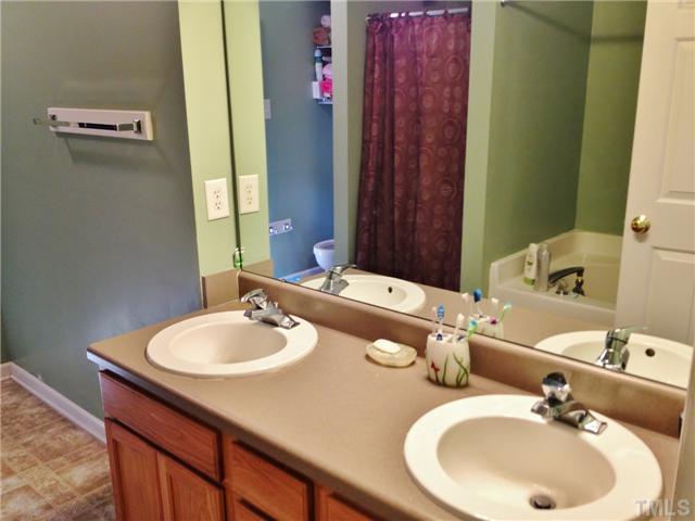 4113 Palafox Court Raleigh, NC 27604 - Photo 18 of 25 a bathroom with a sink and a mirror