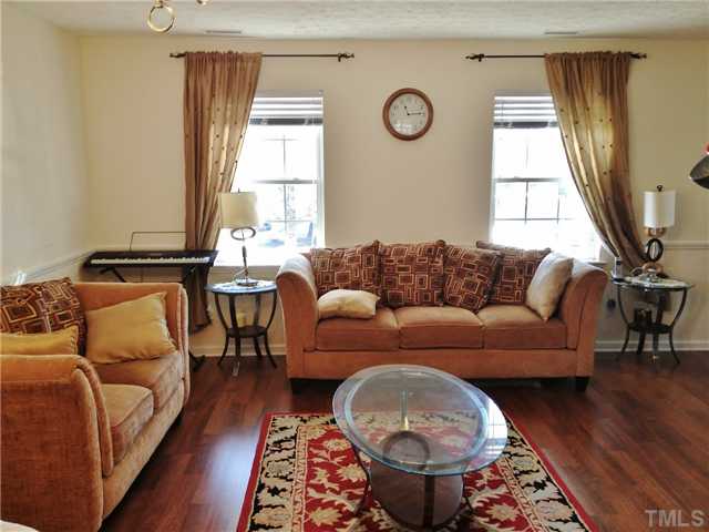 4113 Palafox Court Raleigh, NC 27604 - Photo 4 of 25 a living room with furniture and a wooden floor