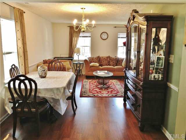 4113 Palafox Court Raleigh, NC 27604 - Photo 6 of 25 a view of a dining room with furniture and chandelier
