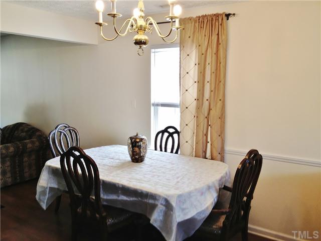 4113 Palafox Court Raleigh, NC 27604 - Photo 7 of 25 a dining room with furniture and chandelier