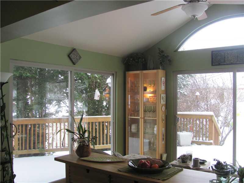 3 Robinhood Road Green Tree, PA 15220 - Photo 23 of 25 Great Room. Familyl Room Addition with Cathedral Ceiling, Ceiling Fan with Light, Three Walls of Windows, and a Palladium Window bring the beauty of the seasons of nature inside.