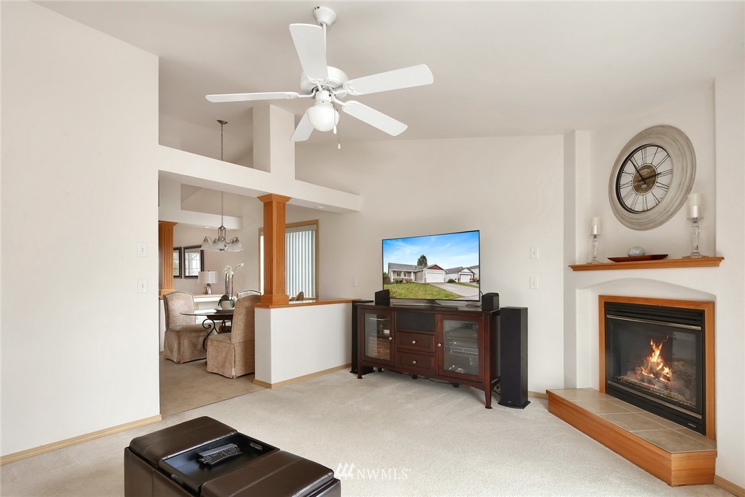 7503 Seashell Way Blaine, WA 98230 - Photo 16 of 31 a view of kitchen with furniture and a fireplace