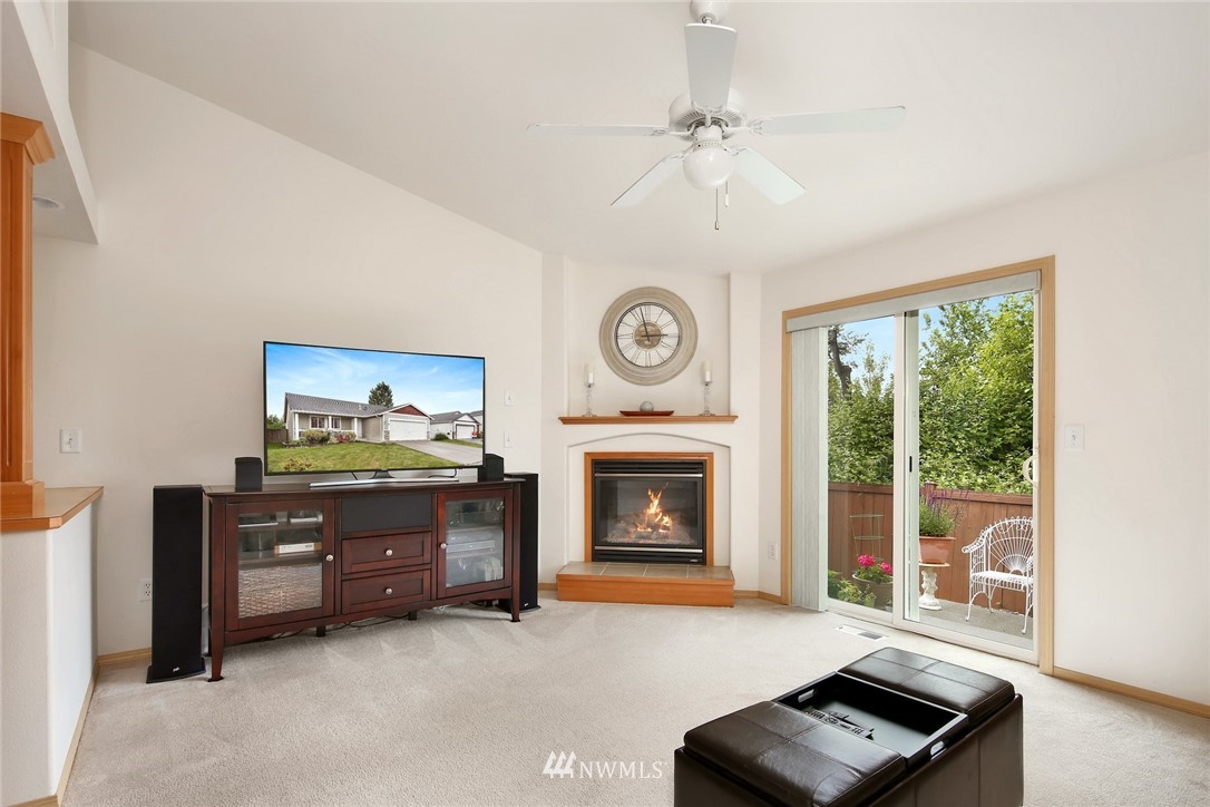 7503 Seashell Way Blaine, WA 98230 - Photo 17 of 31 a living room with furniture and a fireplace