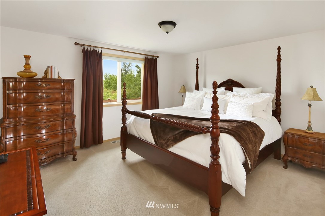 7503 Seashell Way Blaine, WA 98230 - Photo 19 of 31 a bedroom with a bed and a window