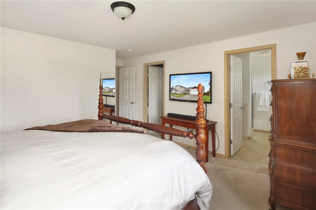 7503 Seashell Way Blaine, WA 98230 - Photo 20 of 31 a bedroom with a bed and a dresser