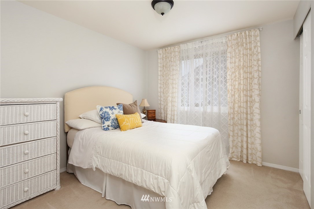 7503 Seashell Way Blaine, WA 98230 - Photo 23 of 31 a bedroom with a bed and a window