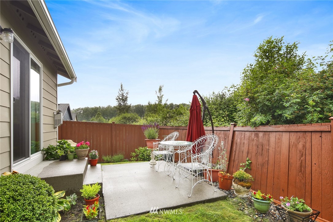 7503 Seashell Way Blaine, WA 98230 - Photo 27 of 31 a view of a backyard with sitting area