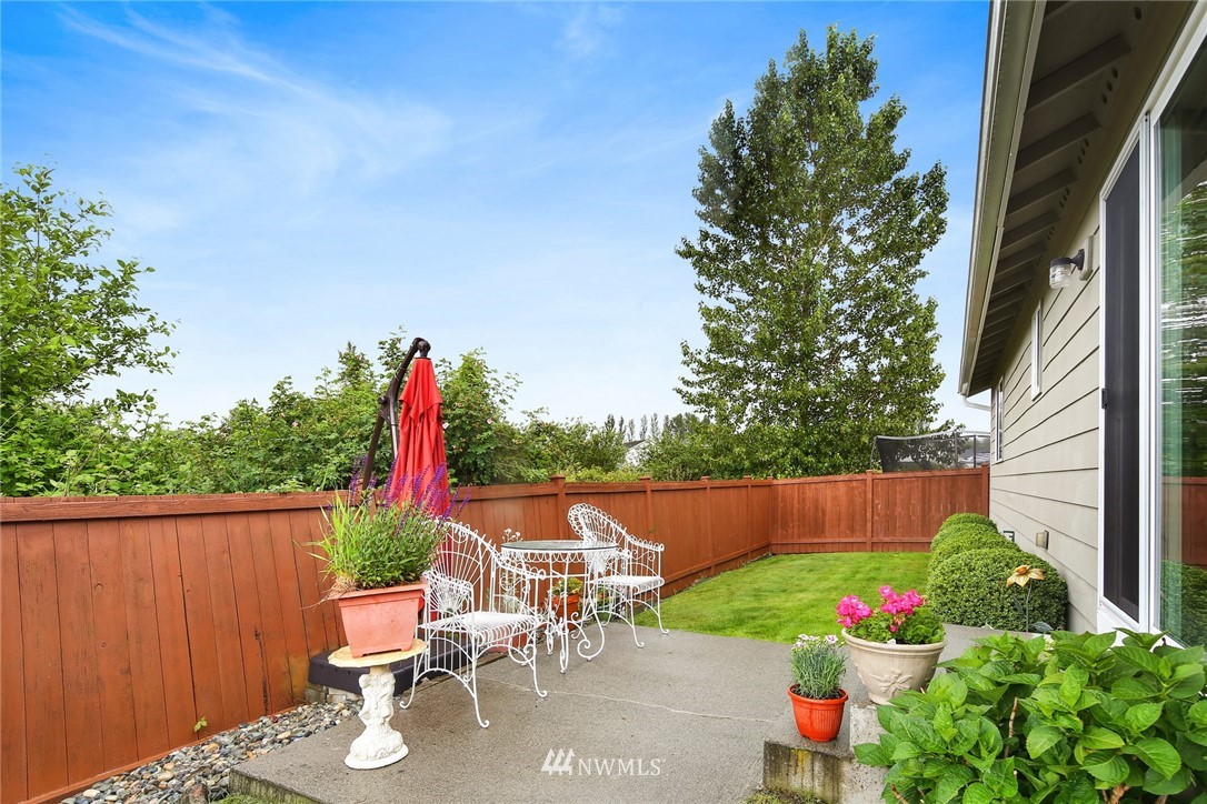7503 Seashell Way Blaine, WA 98230 - Photo 28 of 31 a view of backyard with seating and green space
