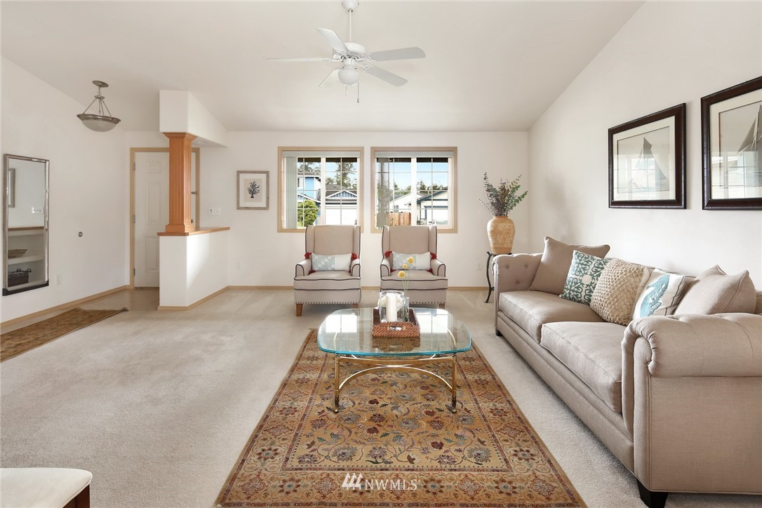 7503 Seashell Way Blaine, WA 98230 - Photo 5 of 31 a living room with furniture and a large window