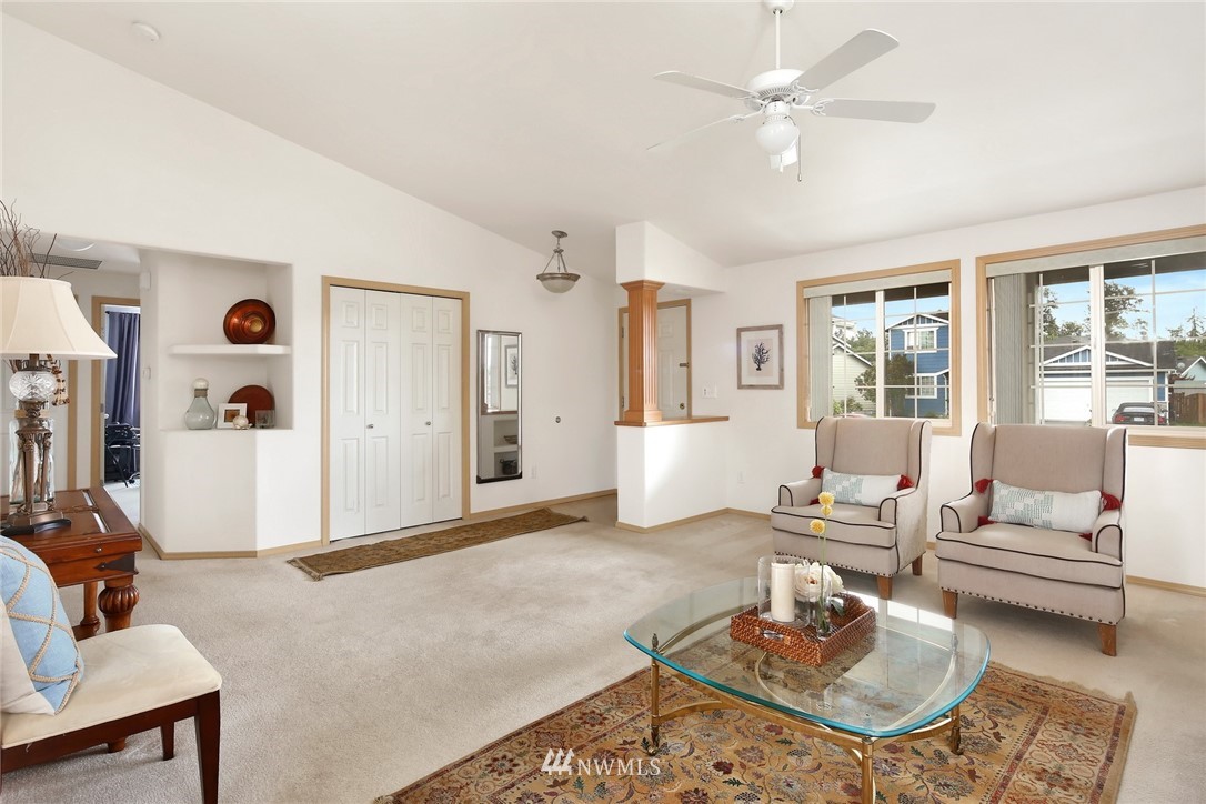 7503 Seashell Way Blaine, WA 98230 - Photo 6 of 31 a living room with furniture a rug and a chandelier