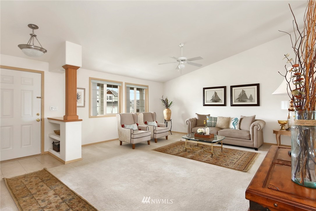7503 Seashell Way Blaine, WA 98230 - Photo 7 of 31 a living room with furniture and a rug