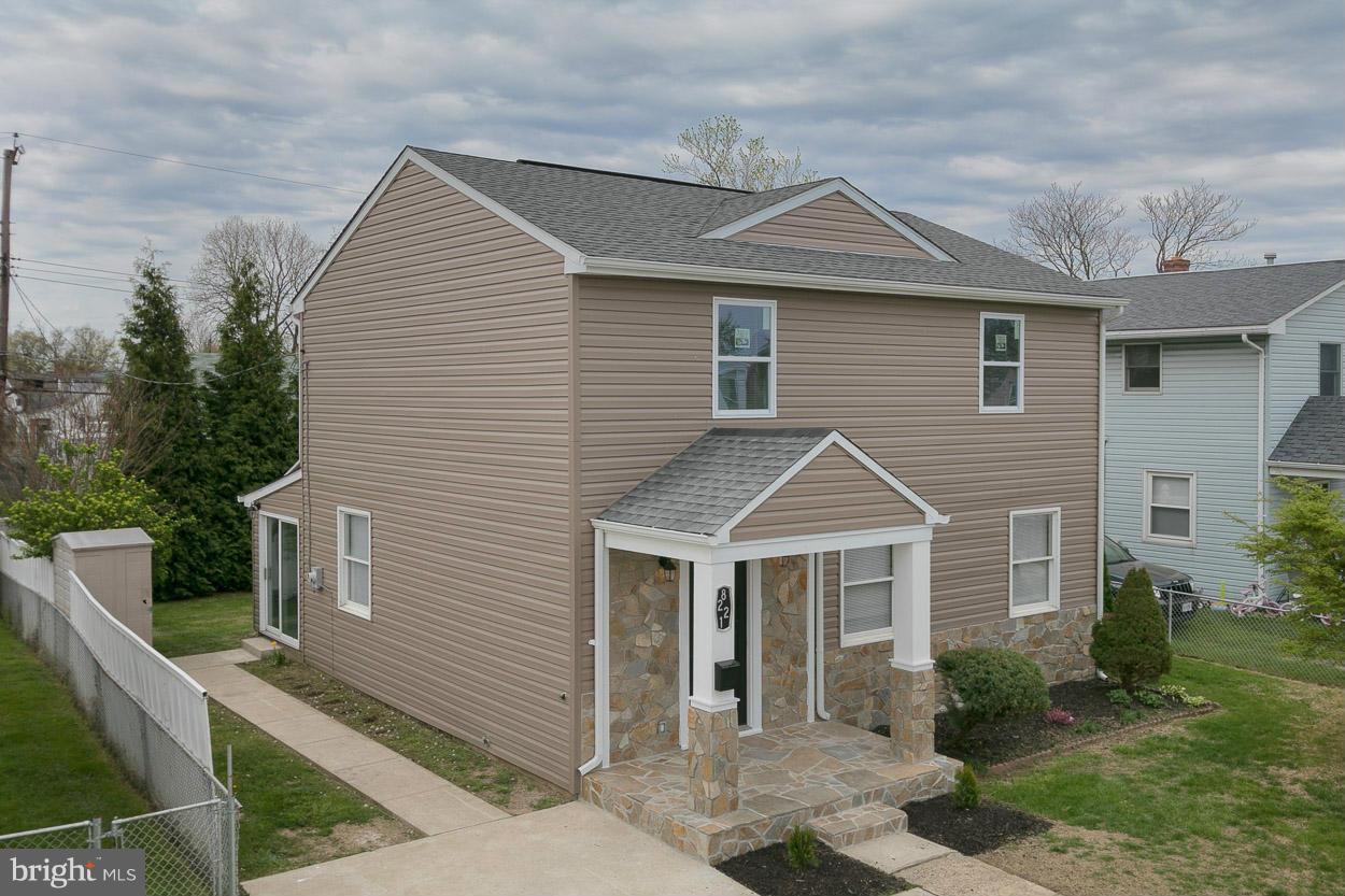 8221 Longpoint Road Baltimore, MD 21222 - Photo 1 of 24 a front view of a house with garden
