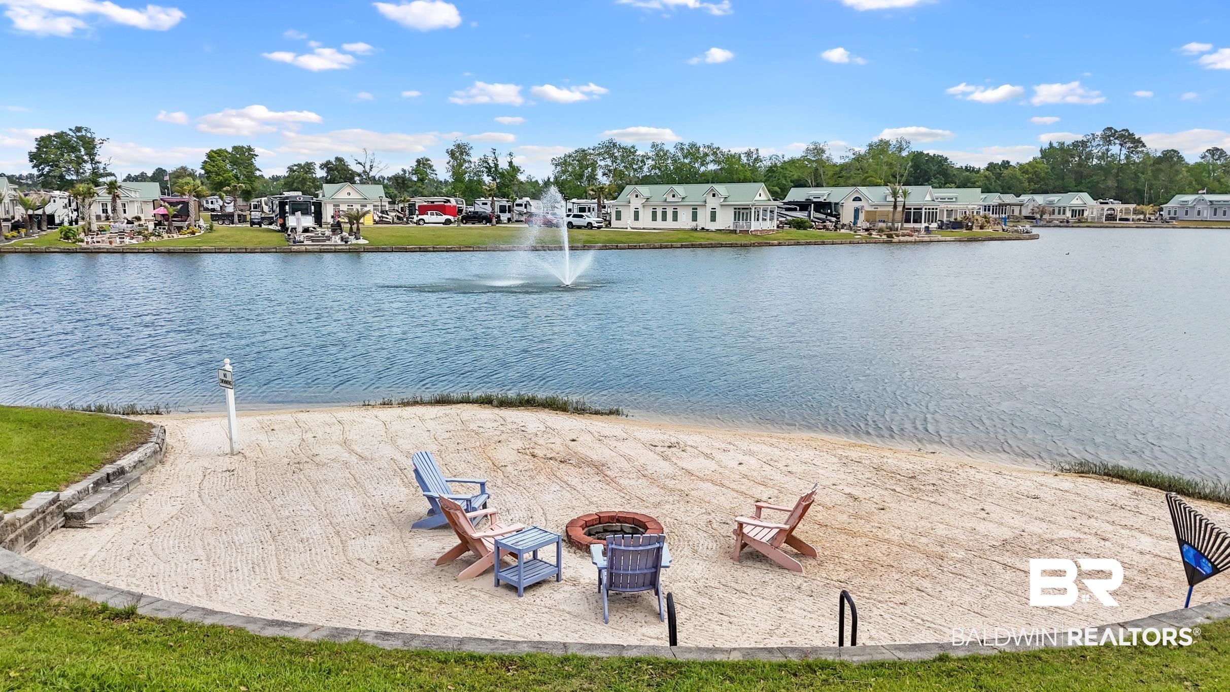 11996 Raptor Court Elberta, AL 36530 - Photo 40 of 45 Water view featuring an outdoor fire pit and nearby suburban area