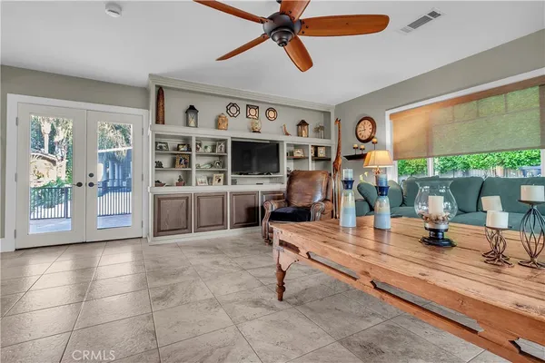 a dining room with stainless steel appliances kitchen island granite countertop furniture and a fireplace
