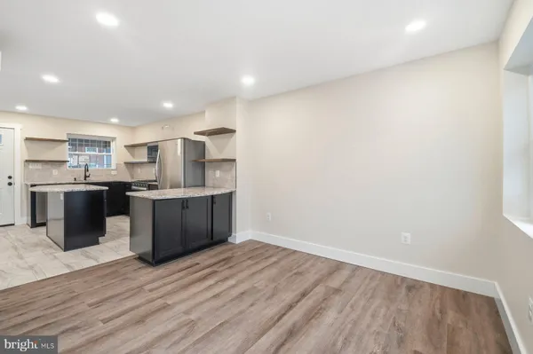 a view of kitchen with wooden floor