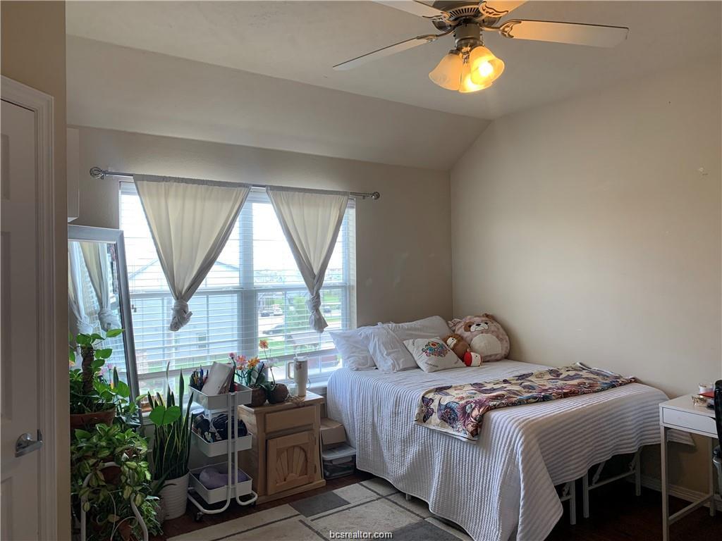 1198 Jones-Butler Road, Unit 1509 College Station, TX 77840 - Photo 5 of 8 a bedroom with a bed and a large window